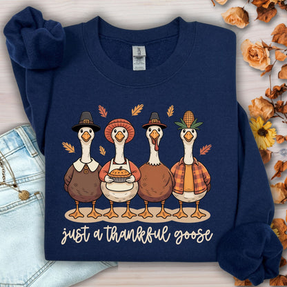 Navy S sweatshirt with pilgrim ducks, apple pie, and "just a thankful goose" text.