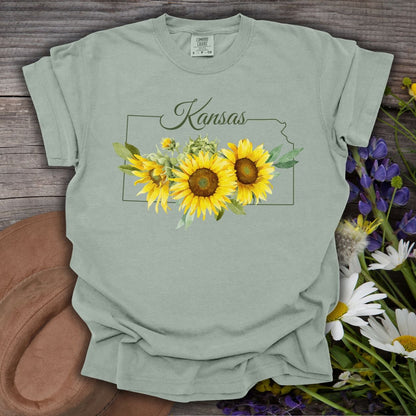 Bay green garment-dyed cotton t-shirt with Kansas outline and watercolor sunflowers.