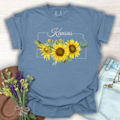 Blue Jean Kansas State Flower T-shirt with golden sunflowers and state outline, made from soft, garment-dyed cotton.