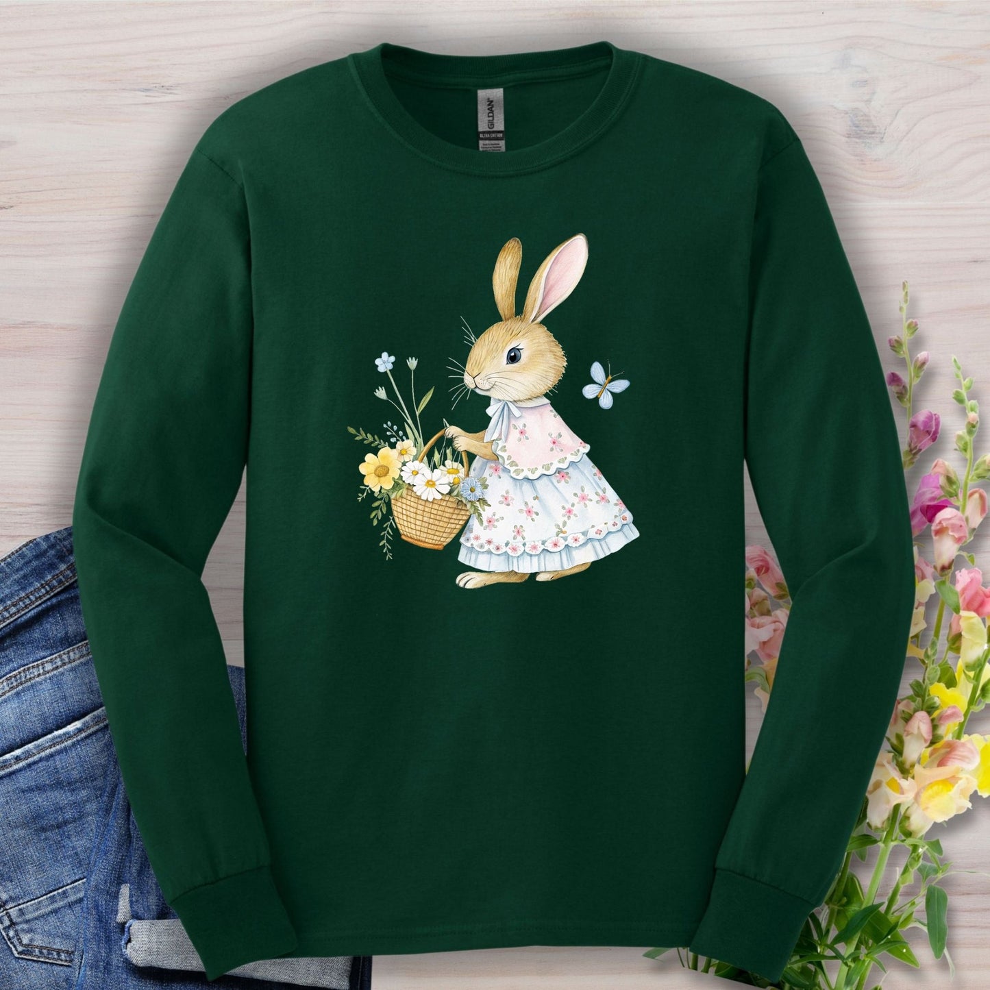 Forest Green long-sleeve tee with a watercolor lady bunny in a floral dress holding a spring flower basket.