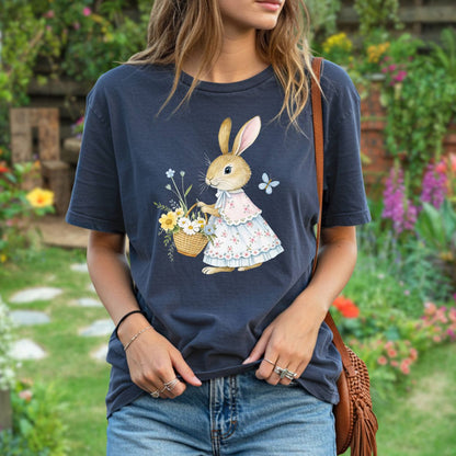 Relaxed-fit, garment-dyed navy t-shirt with a watercolor bunny in a floral dress holding a flower basket.
