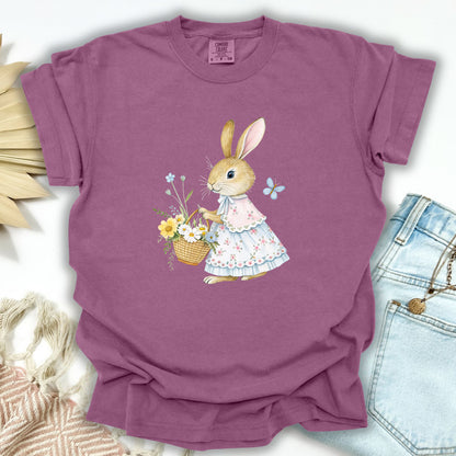 Berry S t-shirt with a watercolor bunny in a floral dress holding a flower basket.