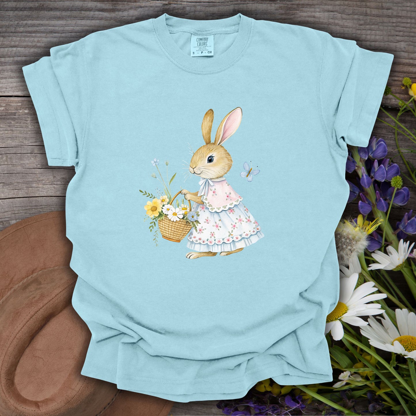 Chambray S t-shirt with a watercolor bunny in a floral dress holding a spring flower basket.