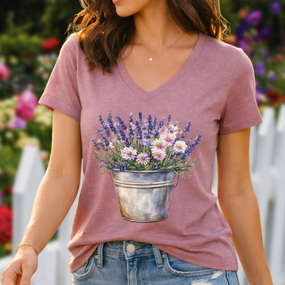 Heather mauve v-neck tee with a faded print of lavender and daisies in a rustic metal pot.