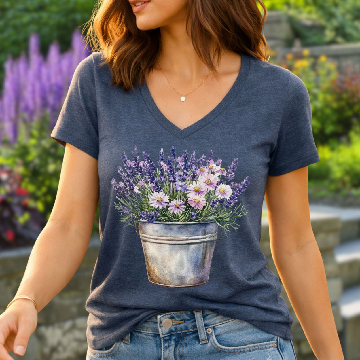 Heather navy v-neck tee with a faded print of lavender and daisies in a rustic metal pot.