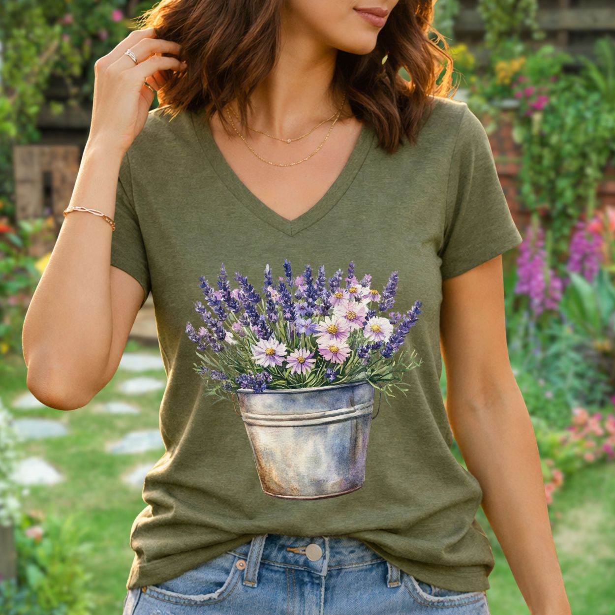 Heather olive green v-neck tee with a faded botanical print of lavender and daisies in a rustic metal pot.