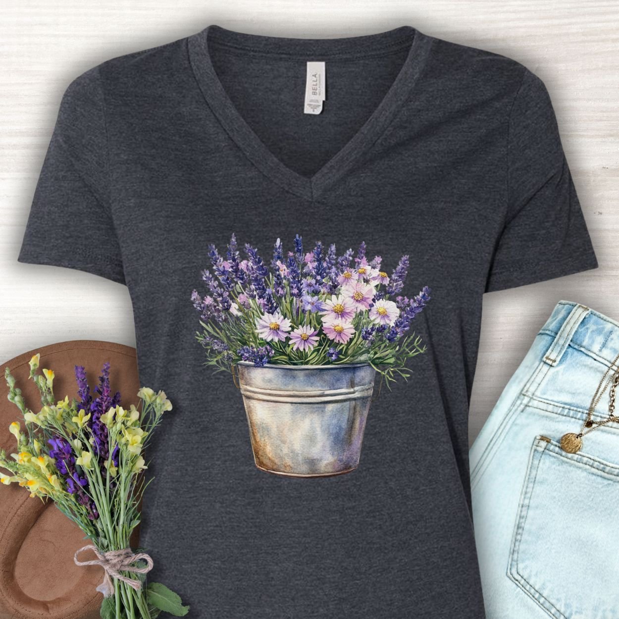 Dark Grey Heather v-neck tee with a faded lavender and daisy bouquet in a rustic metal pot.