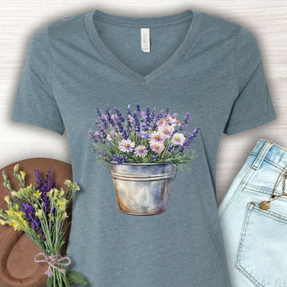 Heather Slate v-neck tee with a faded botanical print of lavender and daisies in a rustic metal pot.