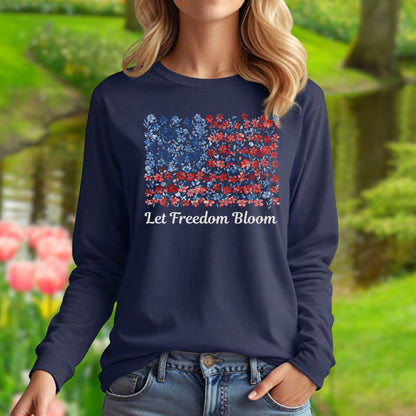 Woman in a navy long sleeve tee with a faded floral flag graphic and "Let Freedom Bloom" text.