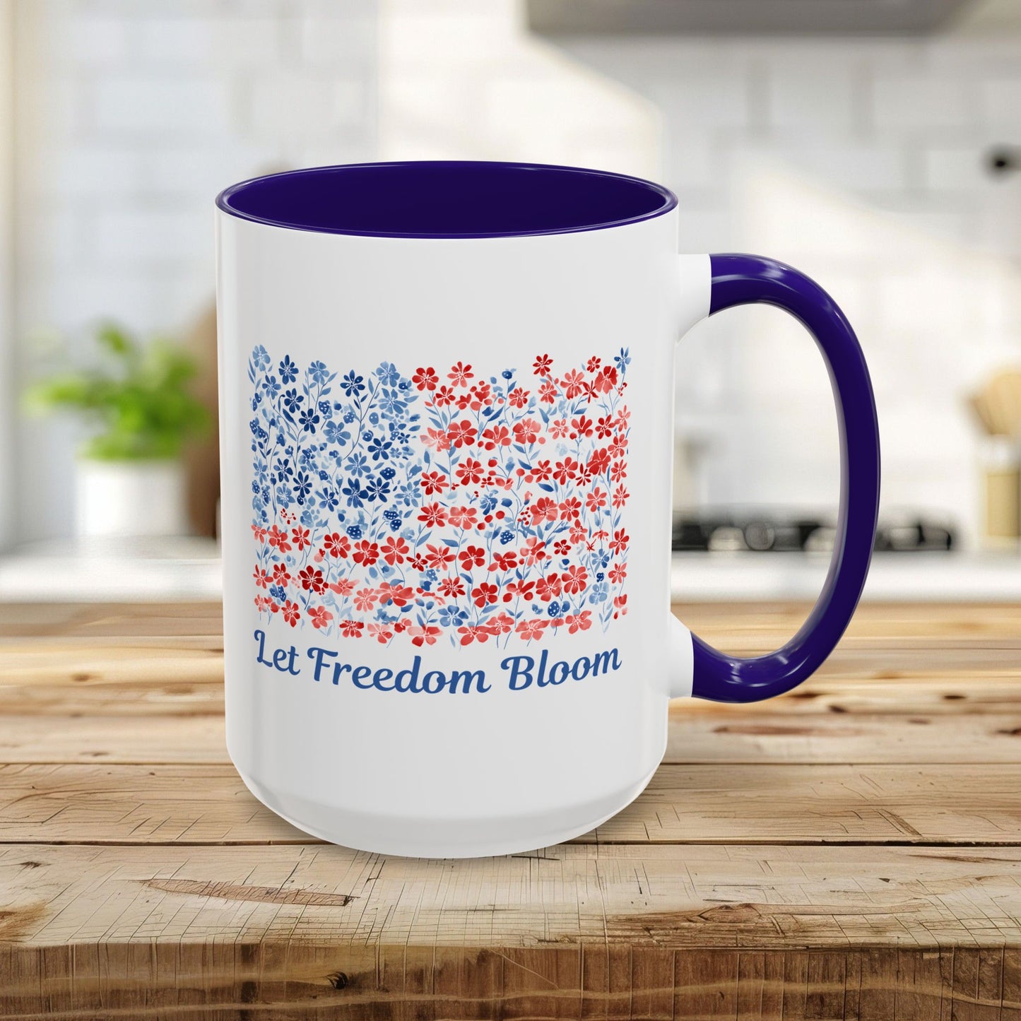 15oz ceramic mug with blue handle/interior, featuring a floral flag design and "Let Freedom Bloom.