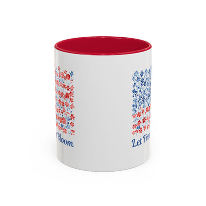 White ceramic mug with red interior and handle, featuring a "Let Freedom Bloom" floral flag design.