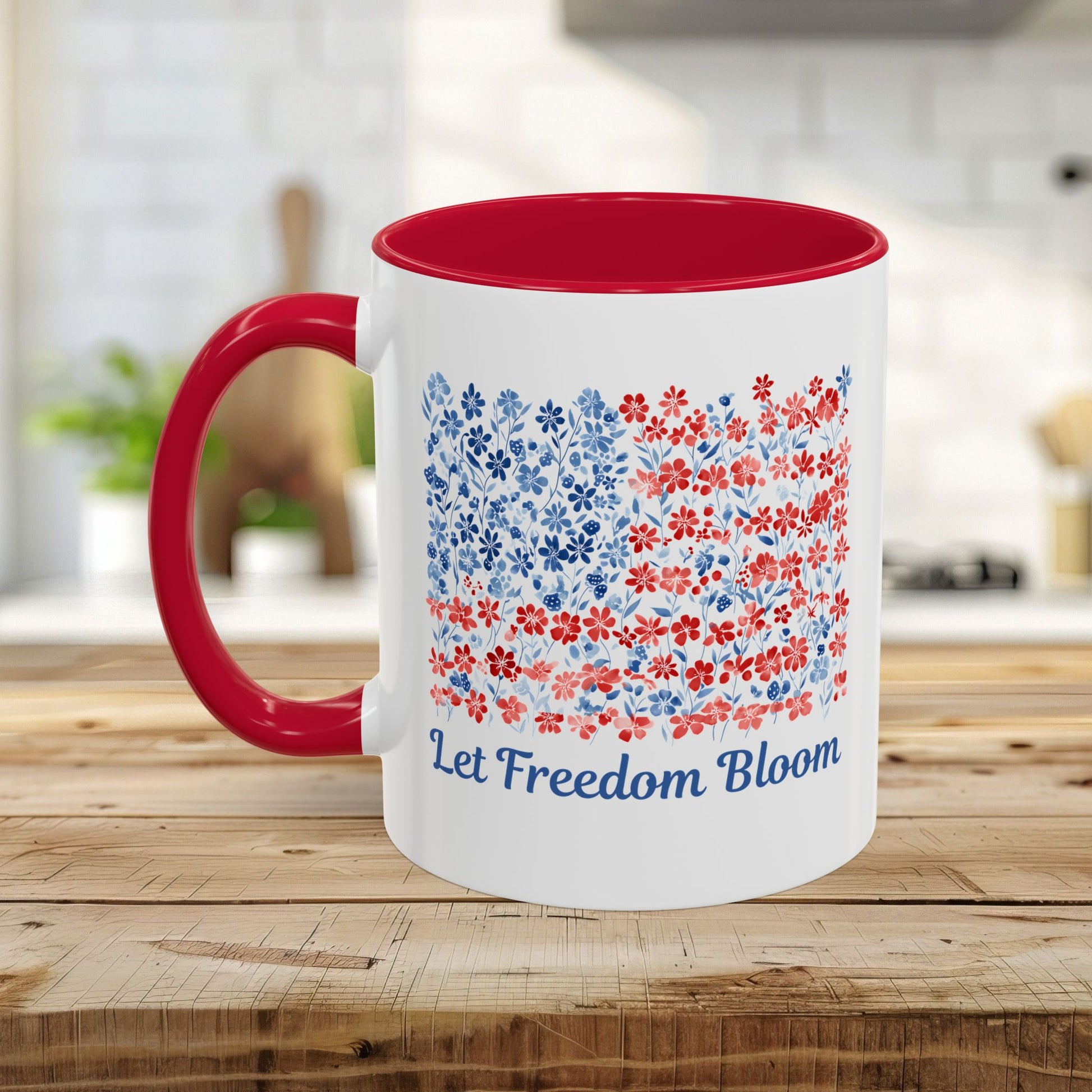 White ceramic mug with red handle and interior, featuring a "Let Freedom Bloom" floral flag design.