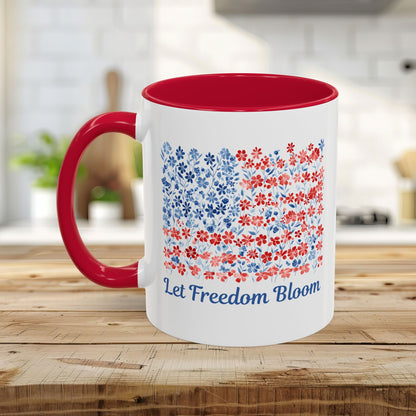 White ceramic mug with red handle and interior, featuring a "Let Freedom Bloom" floral flag design.