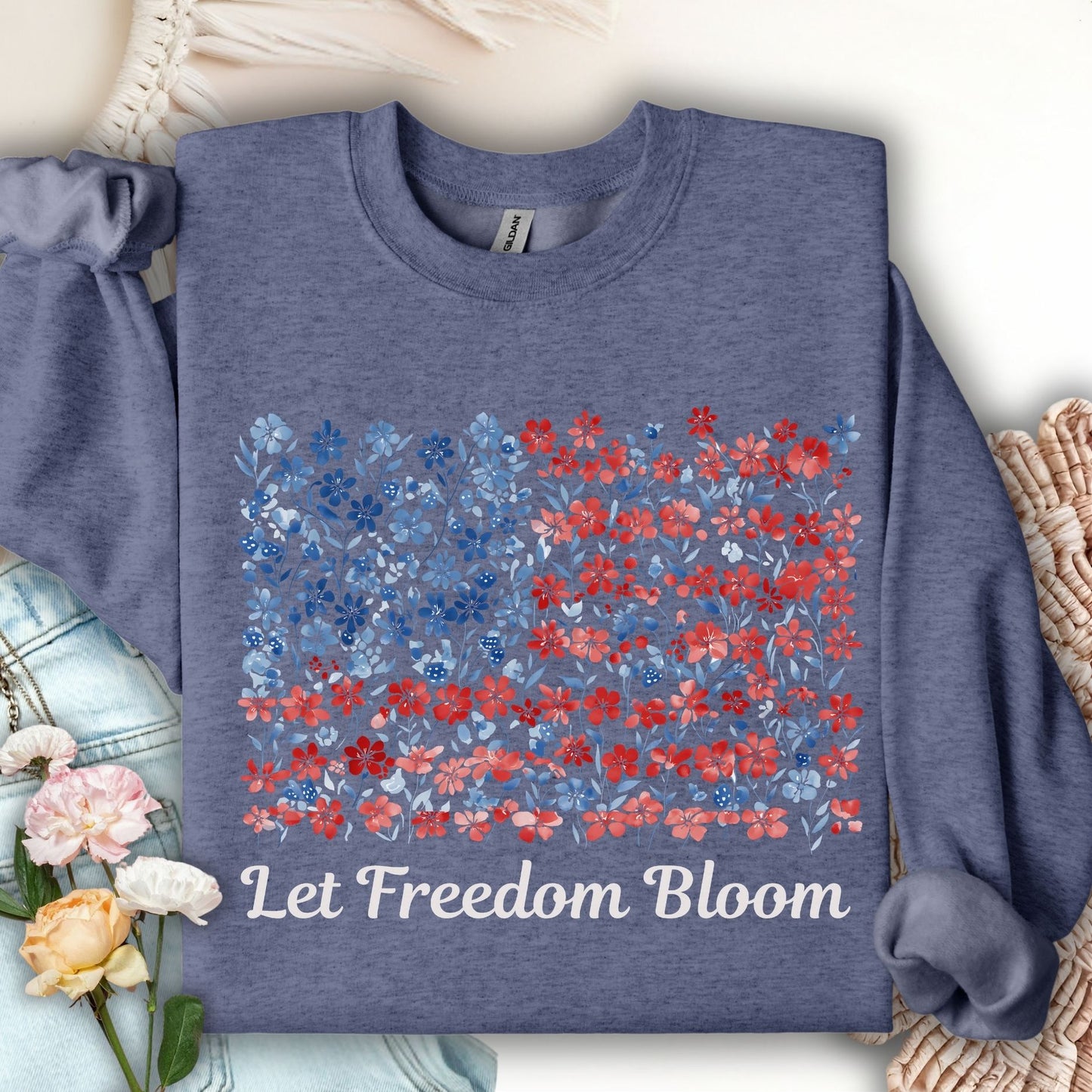 Heather Sport Dark Navy sweatshirt with a floral flag design and "Let Freedom Bloom" text.