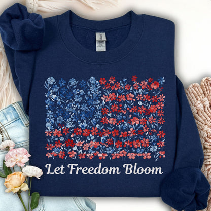 Navy crewneck sweatshirt with a floral flag design and "Let Freedom Bloom" text.