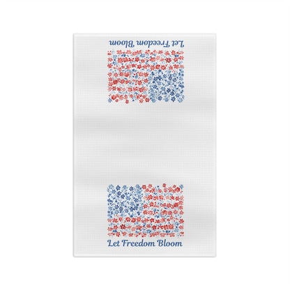 White microfiber tea towel with "Let Freedom Bloom" script and two floral flag designs in red and blue.