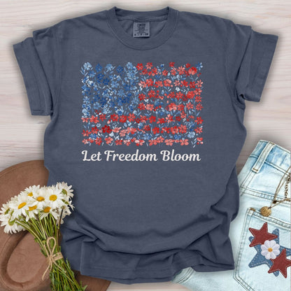 Denim blue t-shirt with a floral USA flag design and "Let Freedom Bloom" text.