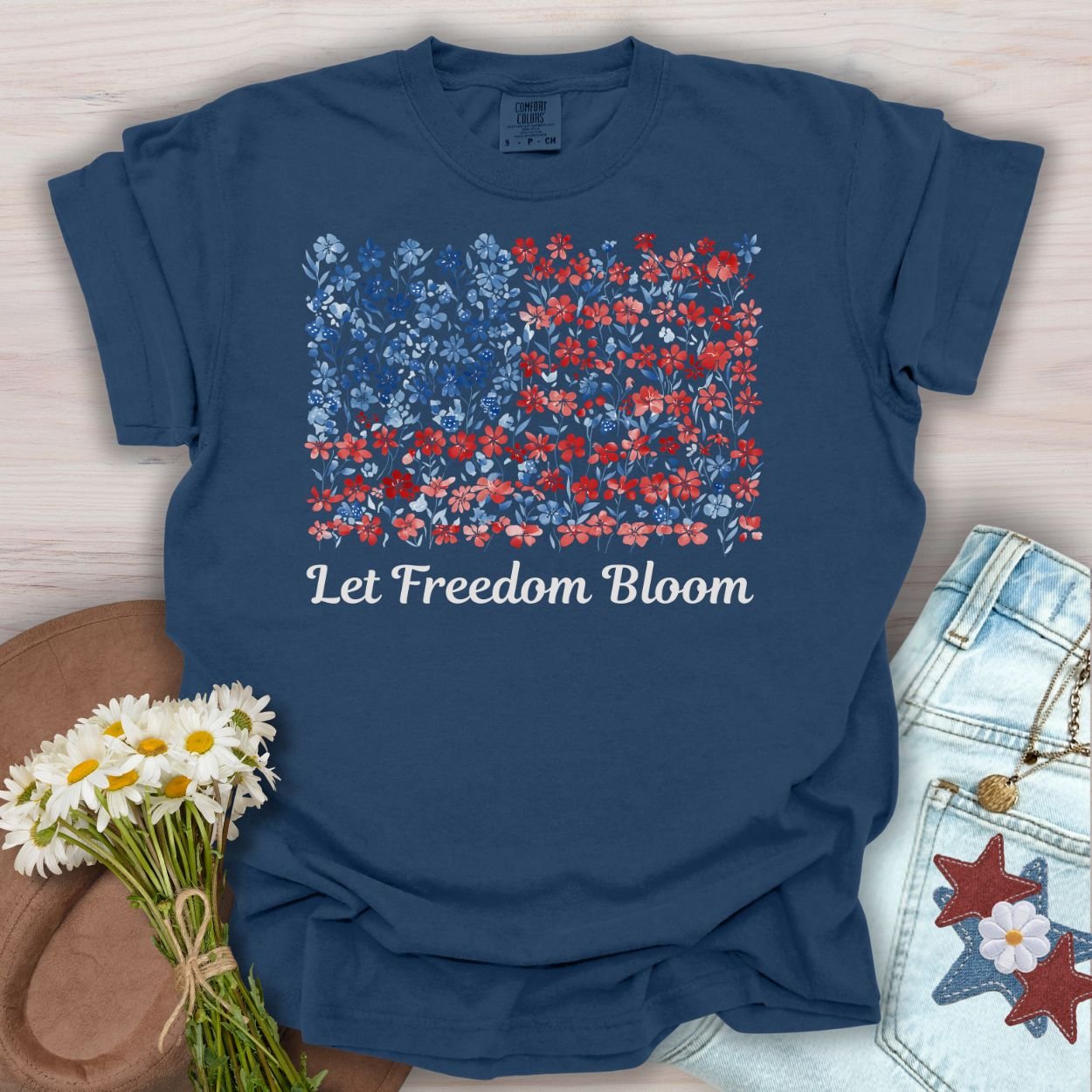 True Navy t-shirt with a floral USA flag design and "Let Freedom Bloom" text.