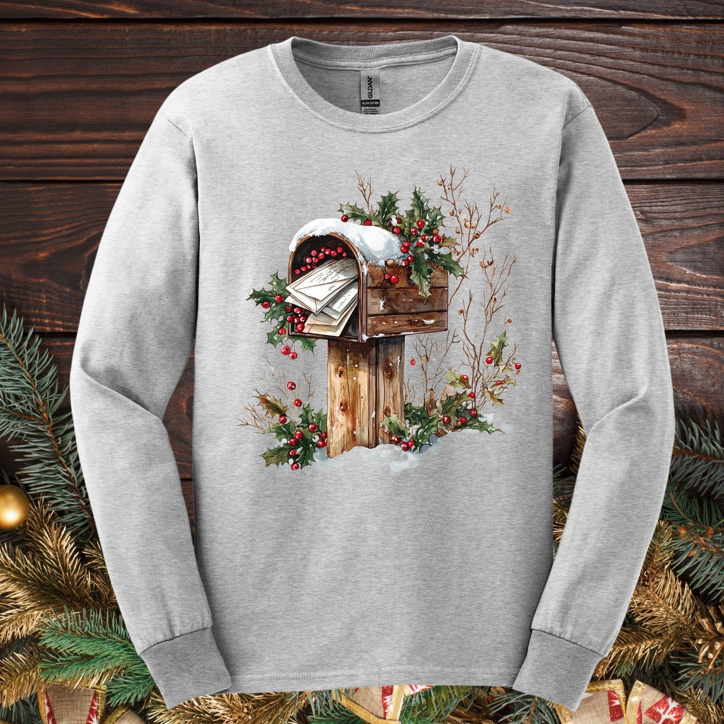 Ash Gildan Softstyle long sleeve tee with a watercolor wooden mailbox full of letters to Santa, snow, and holly.