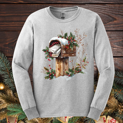 Ash Gildan Softstyle long sleeve tee with a watercolor wooden mailbox full of letters to Santa, snow, and holly.