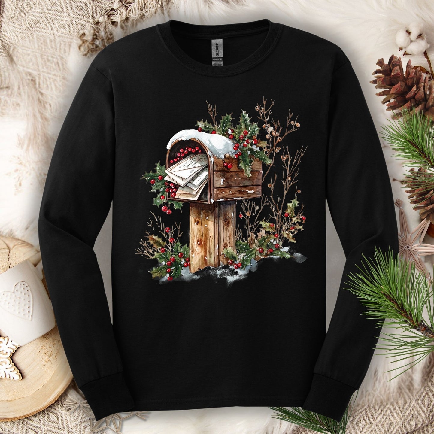 Black Gildan long sleeve tee with a watercolor rustic mailbox full of letters to Santa, snow, and holly.