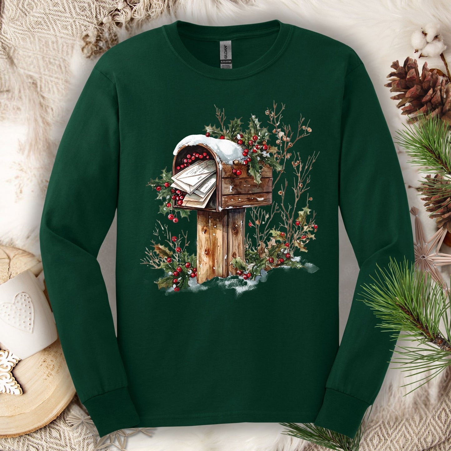 Forest Green long sleeve tee with a watercolor rustic mailbox overflowing with Santa letters, snow, and holly.