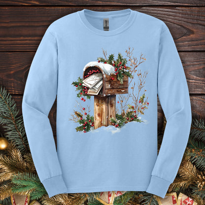 Light blue Gildan long sleeve tee with a watercolor rustic mailbox full of letters to Santa, snow, and holly.