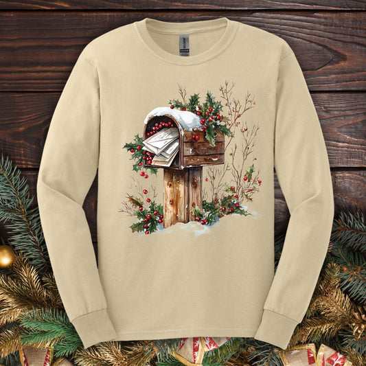 Sand Gildan long sleeve tee with a watercolor vintage Christmas mailbox design.