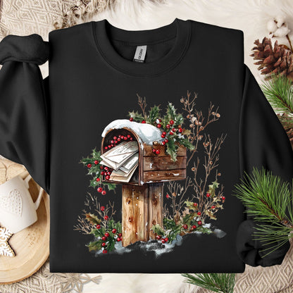 Black Gildan fleece sweatshirt with a watercolor rustic mailbox, snow, and red holly berries design.