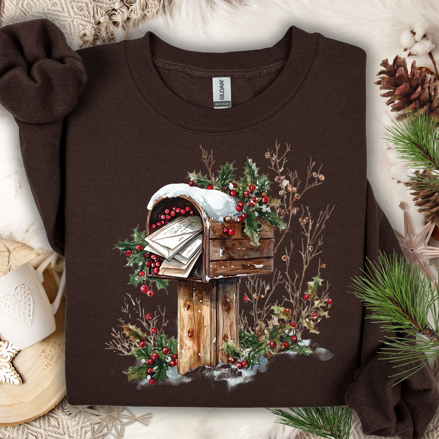 Dark Chocolate Gildan fleece sweatshirt with a watercolor rustic mailbox, snow, and holly berries design.