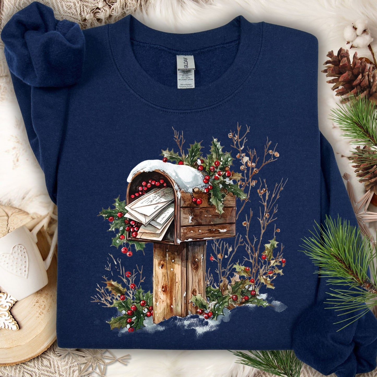 Navy Gildan fleece sweatshirt with a watercolor rustic wooden mailbox, snow, holly, and letters to Santa.