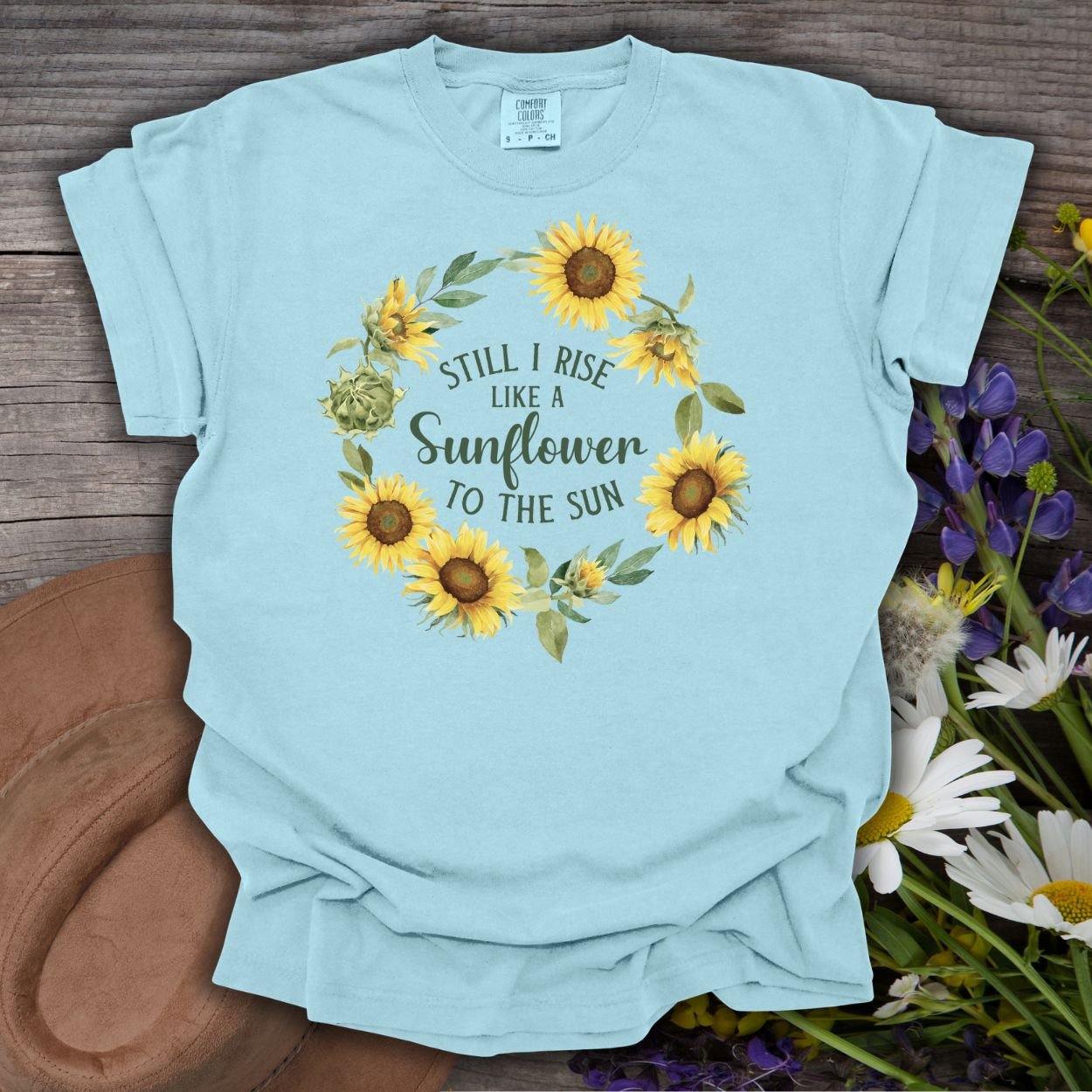 Chambray cotton t-shirt with "Still I Rise Like a Sunflower to the Sun" in a sunflower wreath design.