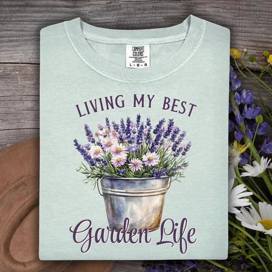 Bay colored "Living My Best Garden Life" t-shirt with a lavender and daisy flower pot design.