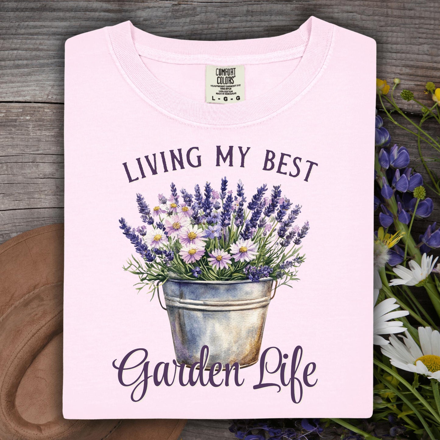 Folded Blossom pink "Living My Best Garden Life" t-shirt with a lavender and daisy bucket graphic.