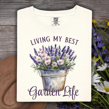 Ivory heavyweight cotton t-shirt with "Living My Best Garden Life" and a lavender and daisy bucket graphic.