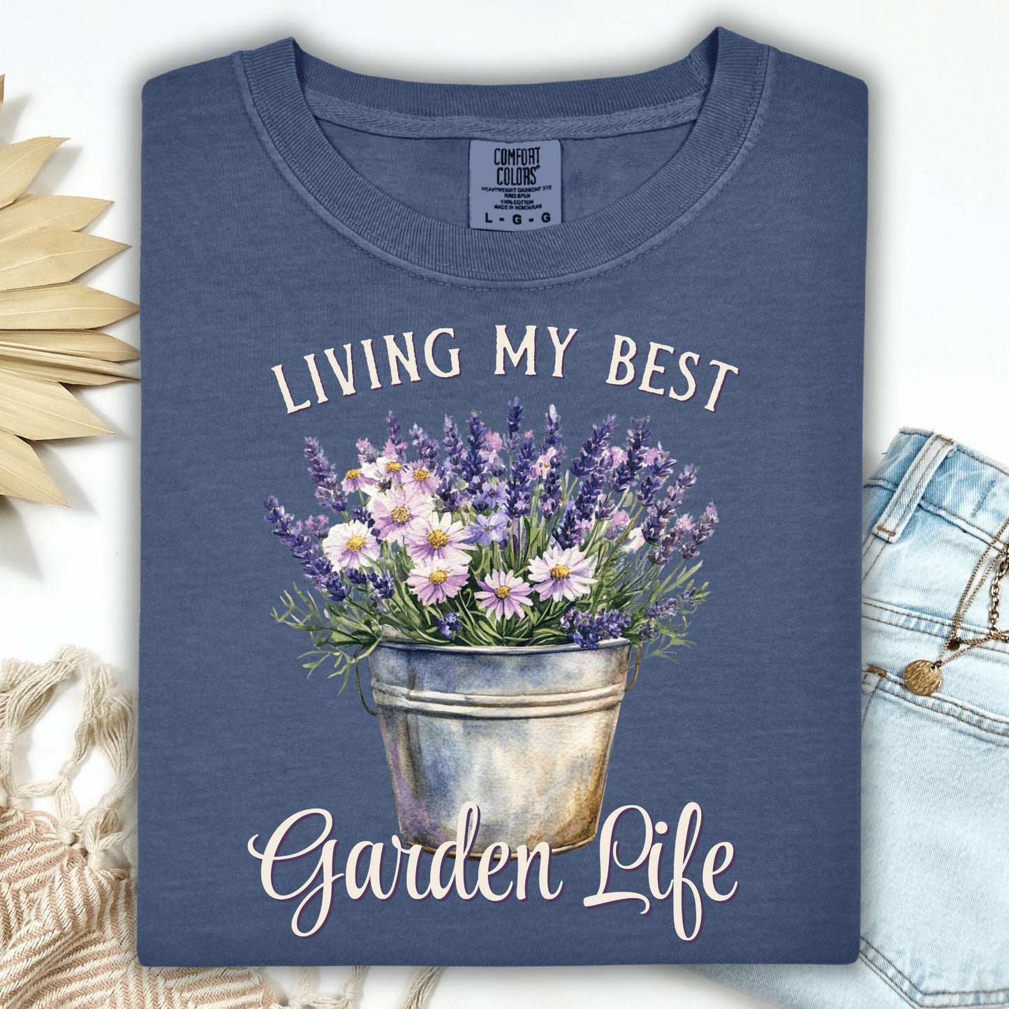Denim blue "Living My Best Garden Life" t-shirt with a watercolor bucket of lavender and daisies.