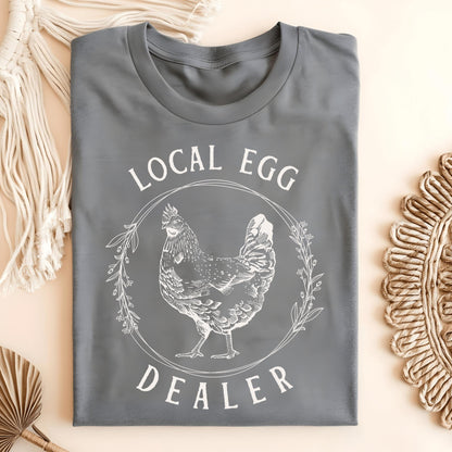 Graphite Heather S Local Egg Dealer t-shirt with a vintage hen and floral wreath design.