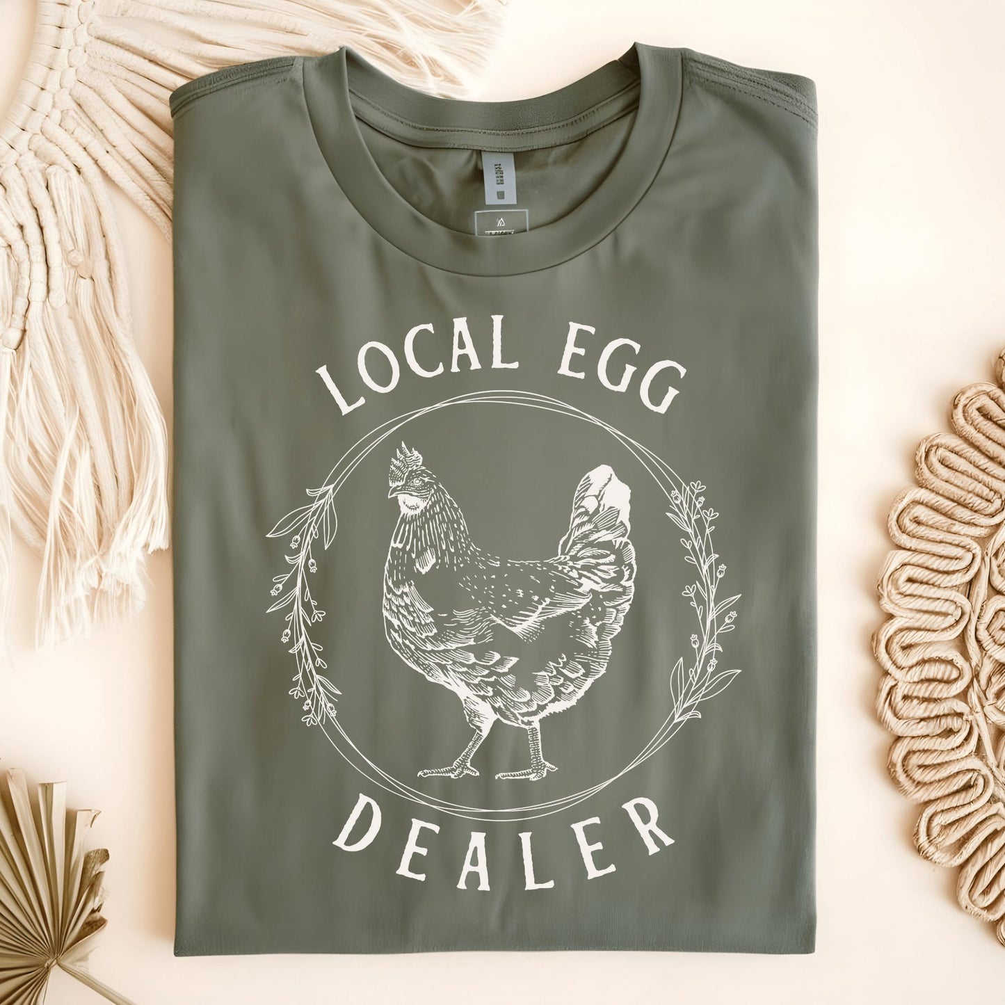 Military Green Local Egg Dealer t-shirt, size S, featuring a vintage hen and floral wreath design.