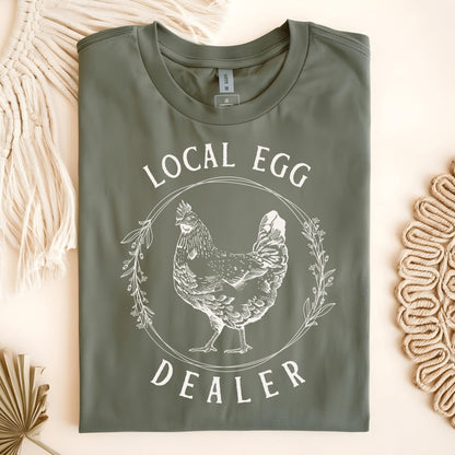 Military Green Local Egg Dealer t-shirt, size S, featuring a vintage hen and floral wreath design.