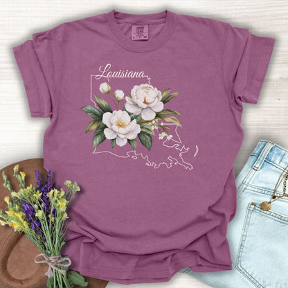 Berry garment-dyed cotton t-shirt with a white magnolia and Louisiana outline graphic.