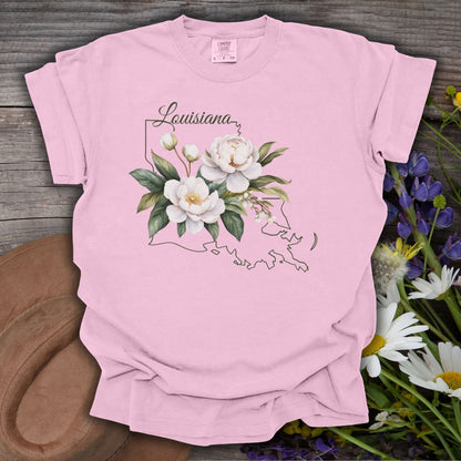 Blossom pink garment-dyed cotton t-shirt with a magnolia illustration over a Louisiana outline.
