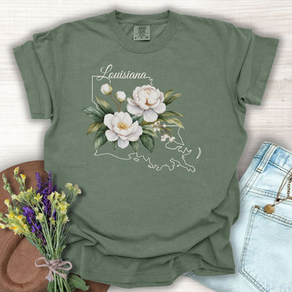 Moss green garment-dyed cotton t-shirt with a white Louisiana outline and magnolia flower design.