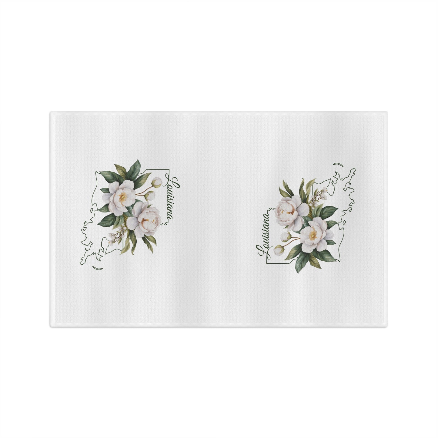White microfiber tea towel with hand-drawn magnolias over a Louisiana outline.