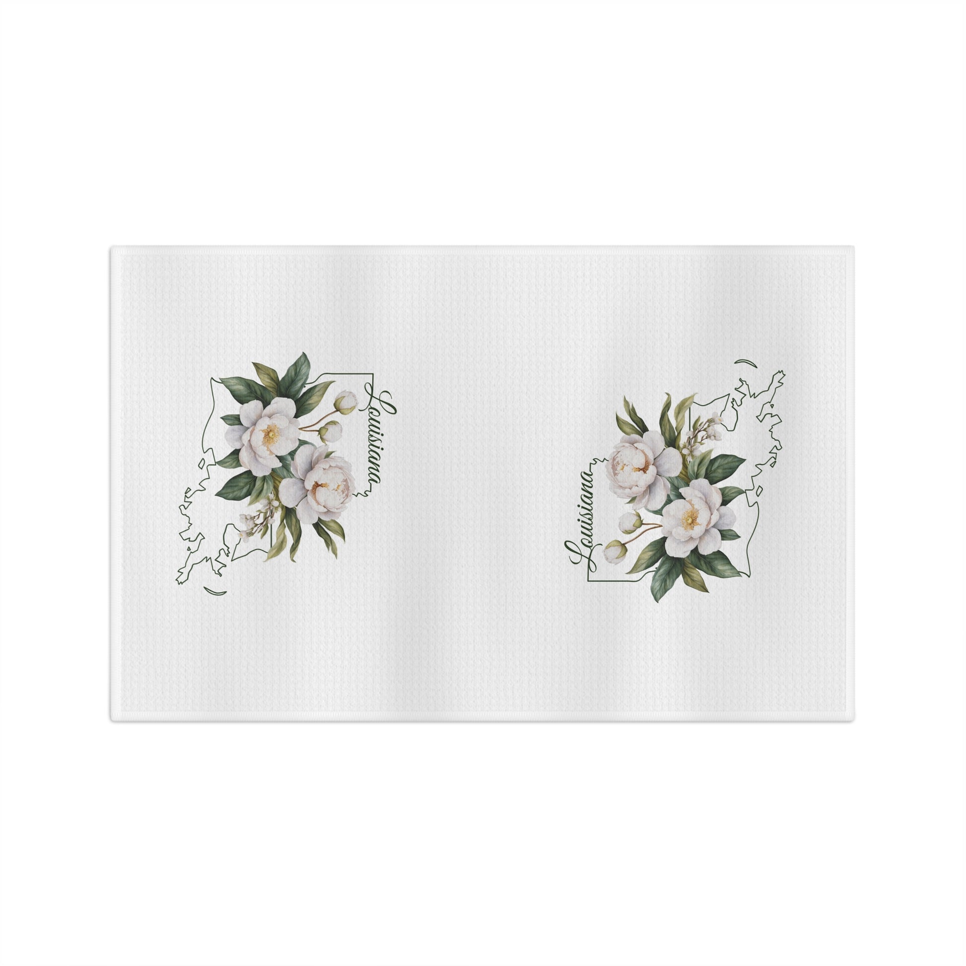 White microfiber tea towel with hand-drawn magnolias over a Louisiana outline.