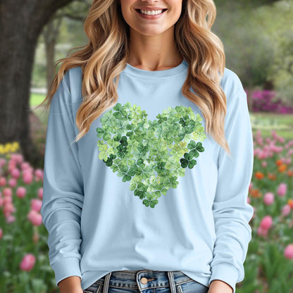 Woman in a light blue long-sleeve tee with a heart made of green clover leaves.