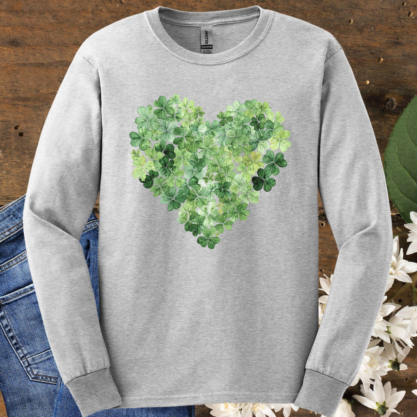 Ash long sleeve tee with a heart-shaped clover graphic, perfect for St. Patrick's Day.