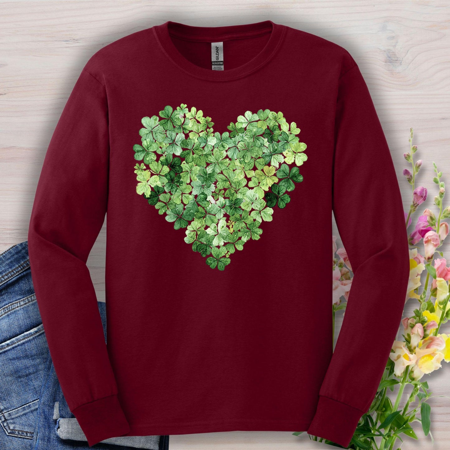 Maroon long-sleeve tee with a heart-shaped clover graphic, perfect for St. Patrick's Day.