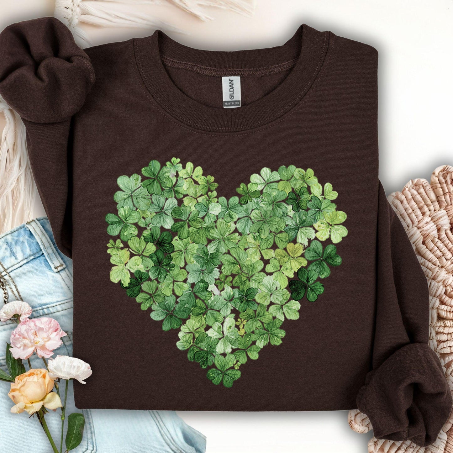 Dark chocolate S sweatshirt with a heart of green four-leaf clovers.