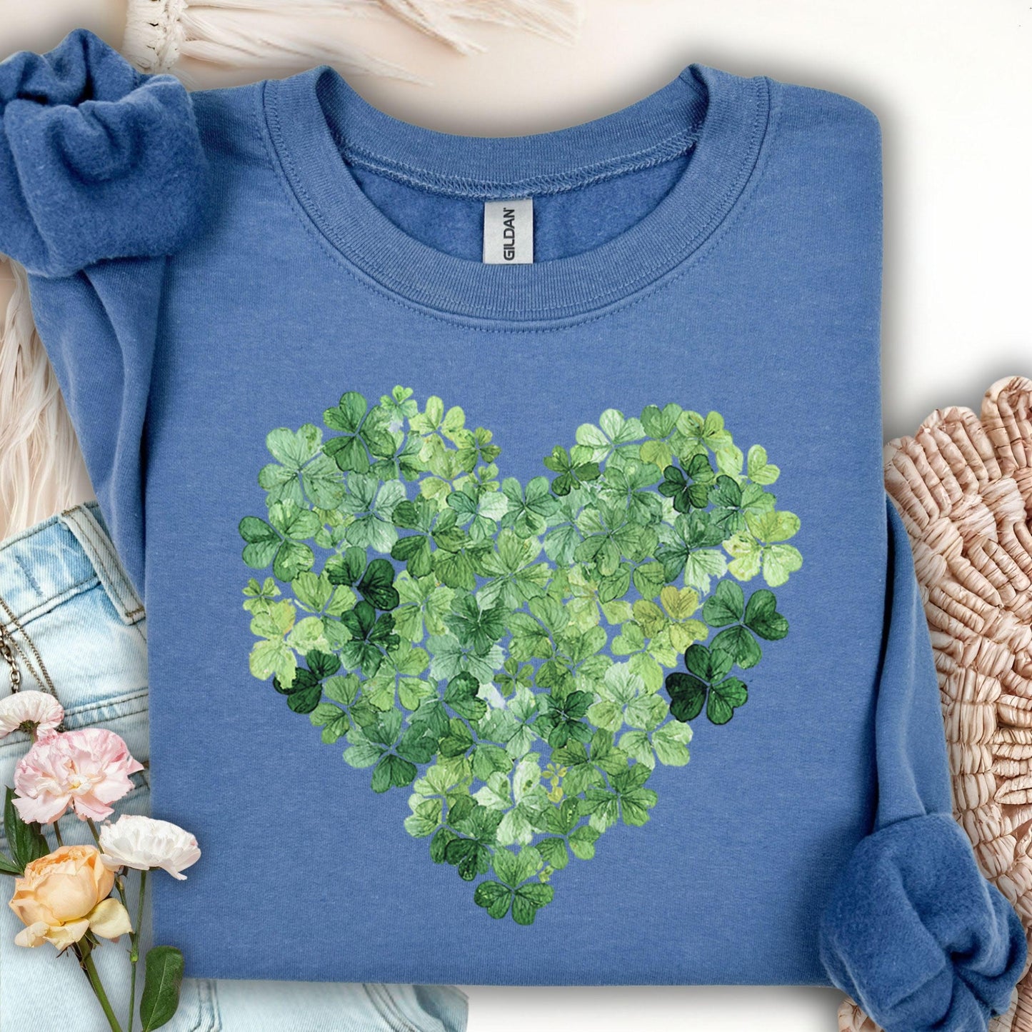 Indigo Blue Lucky Clover Heart Sweatshirt, featuring a heart of green four-leaf clovers.