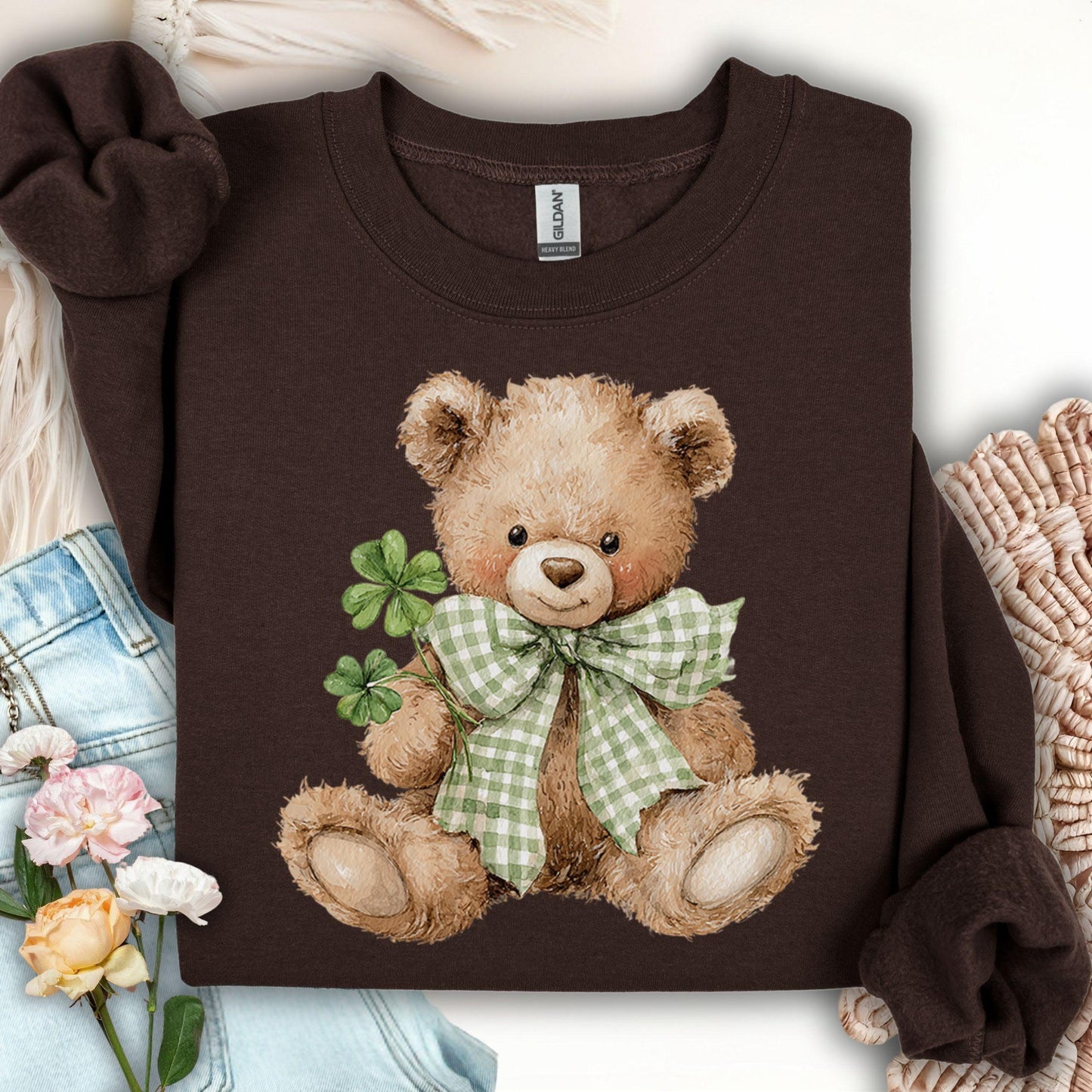Dark Chocolate S sweatshirt with a watercolor teddy bear holding shamrocks and wearing a green gingham bow.